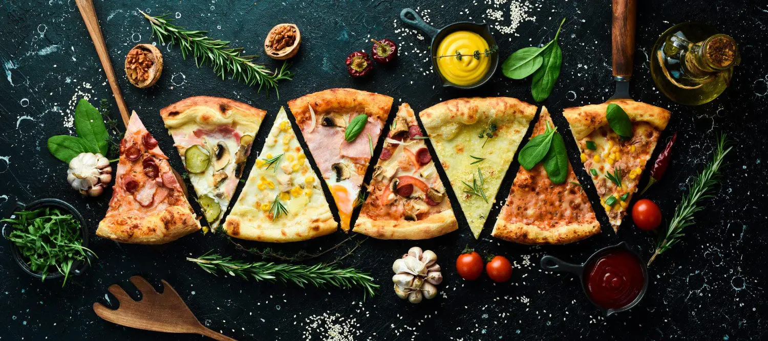 A selection of pizza slices with varied toppings to illustrate how a pizza chain used an OSAT survey to find out why some limited time offers performed better.